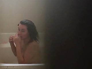Sexy wife getting out of the tub.